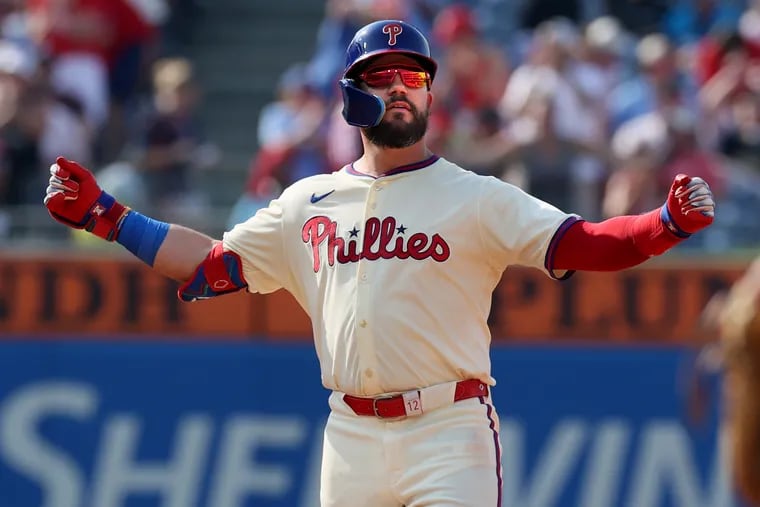 Kyle Schwarber of the Phillies flexes his muscles after hitting a double against the Diamondbacks on June 22, 2024 at Citizens Bank Park.