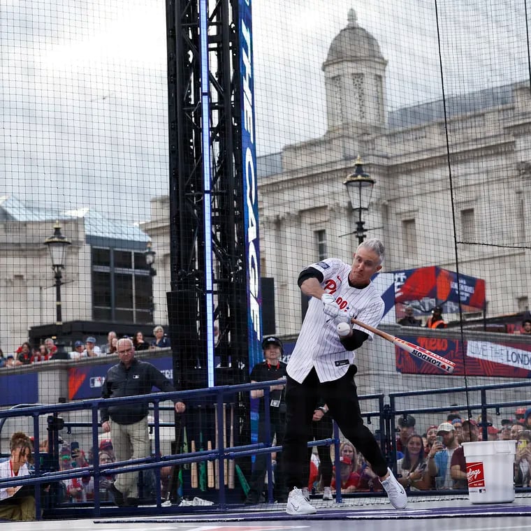 Former Phillies second baseman Chase Utley participates in a home run hitting contest inside The Cage during the Phillies and New York Mets London Series Trafalgar Square Takeover.