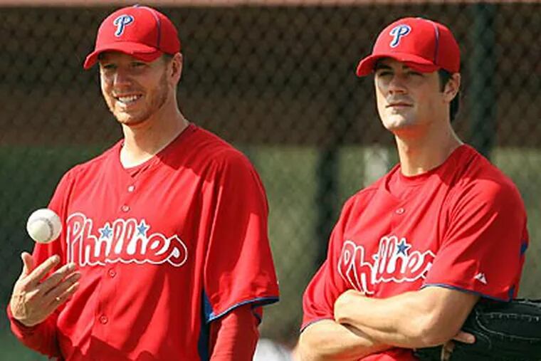 From left, Philadelphia Phillies pitchers Roy Oswalt, Joe Blanton