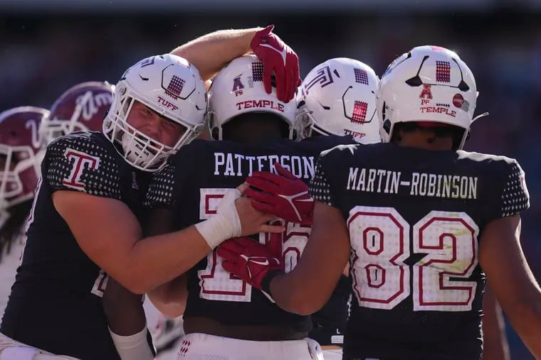 Quincy Patterson (center) of the Temple Owls celebrates with teammates after scoring a touchdown against the Massachusetts Minutemen in the second half at Lincoln Financial Field on September 24, 2022 in Philadelphia, Pennsylvania.