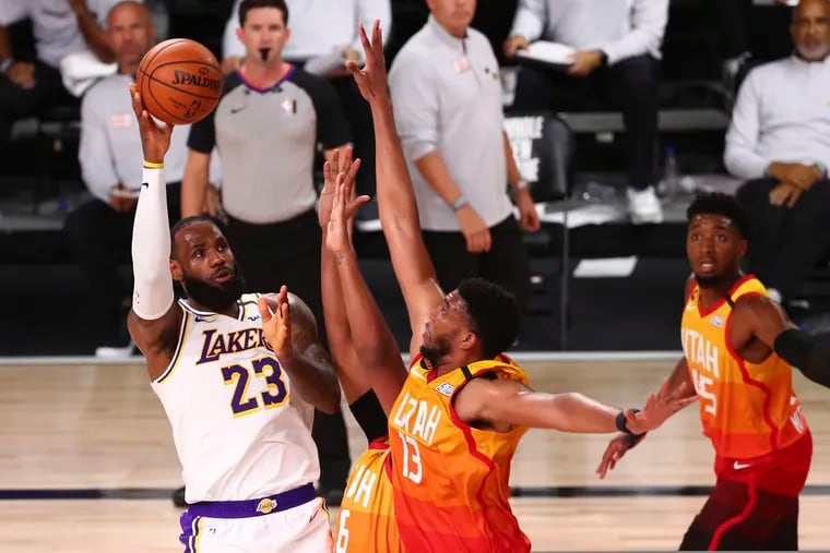 Tony Bradley (center) defending LeBron James during an August game in the NBA bubble.