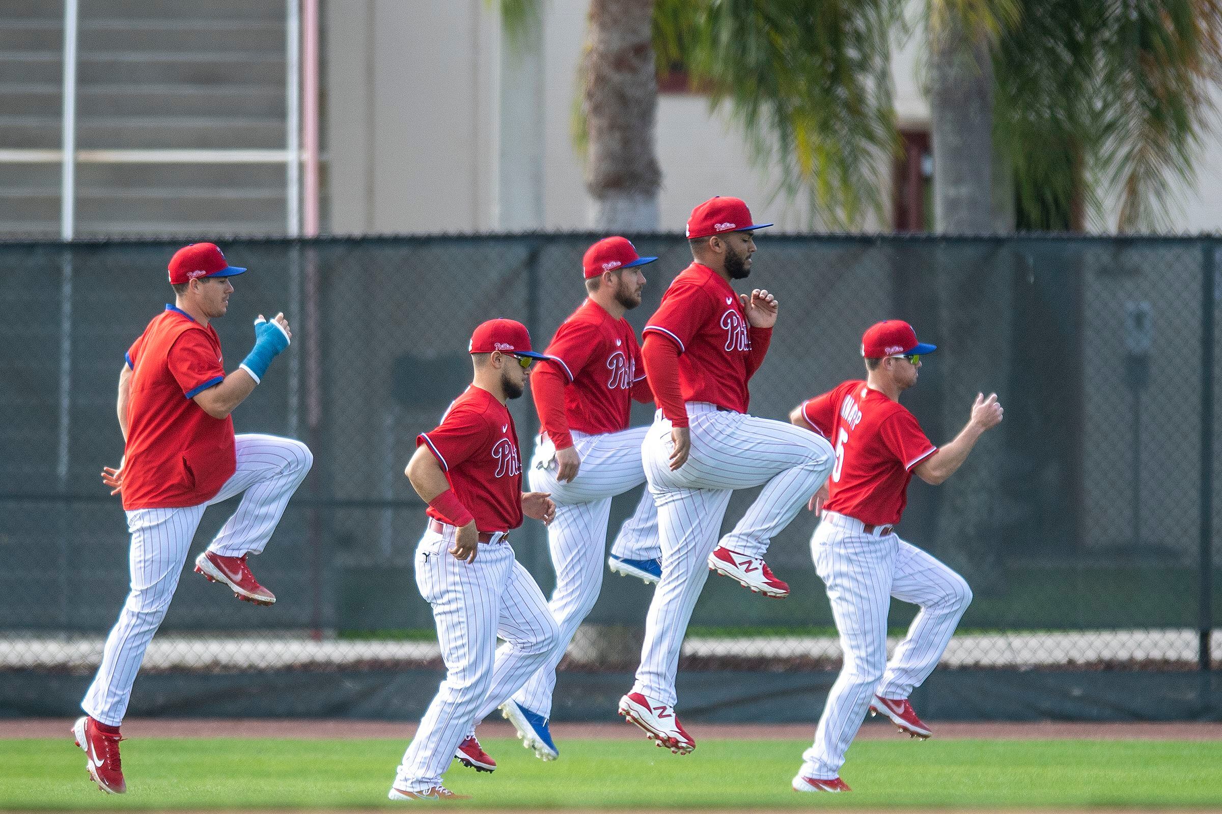 Philadelphia Phillies shortstop Scott Kingery (4) throws to first base  during a spring training baseball game against the Philadelphia Phillies on  March 26, 2023 at Ed Smith Stadium in Sarasota, Florida. (Mike