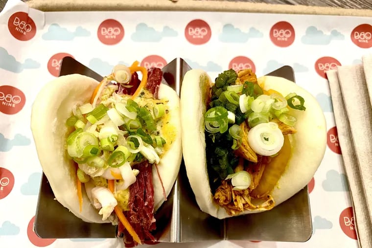 "The yenta" (left), filled with pastrami and mustard, and "the gringo," with roasted chicken and salsa roja, are two of the baos at Bao Nine.