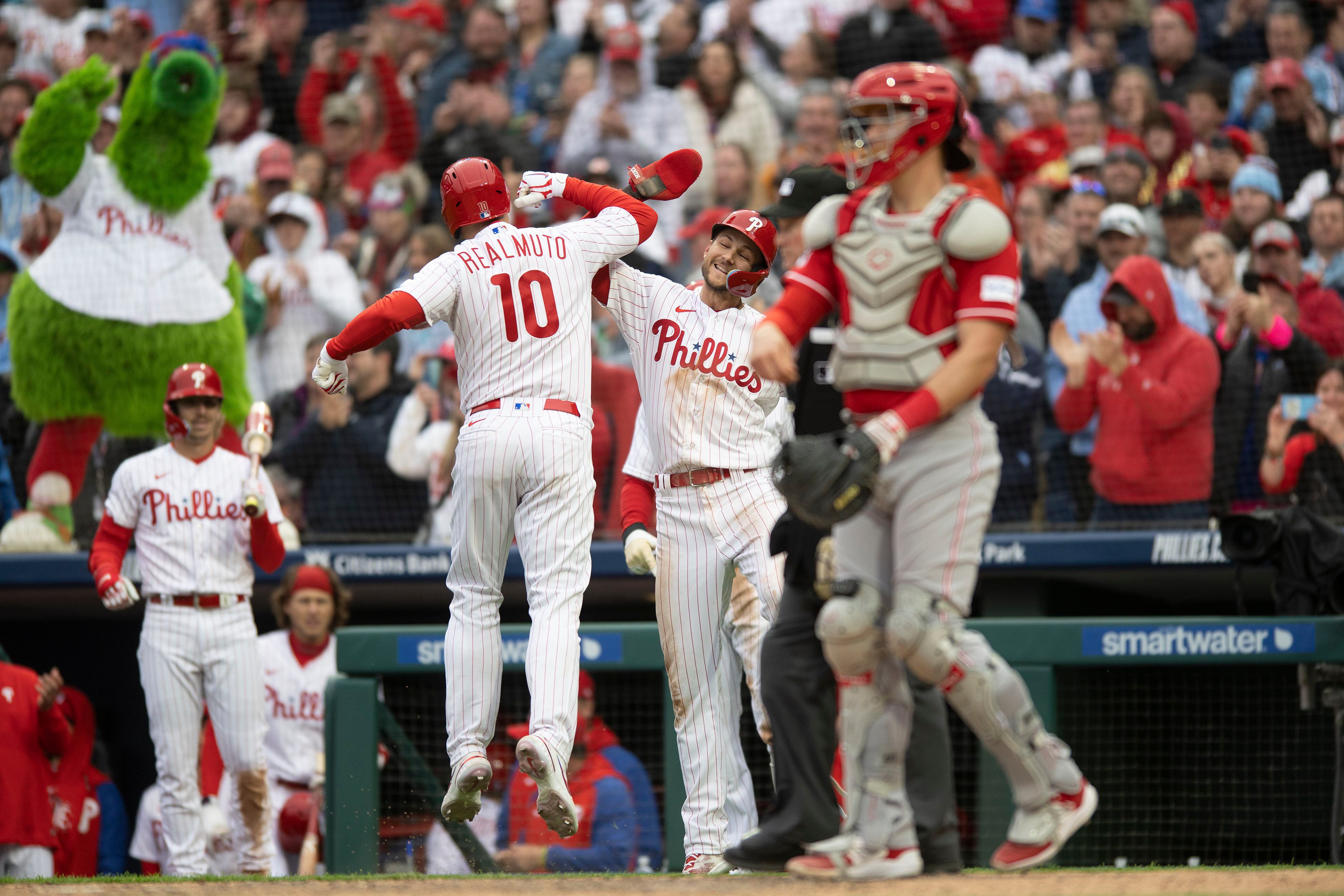 Phillies defeat Reds 5-2 in home opener