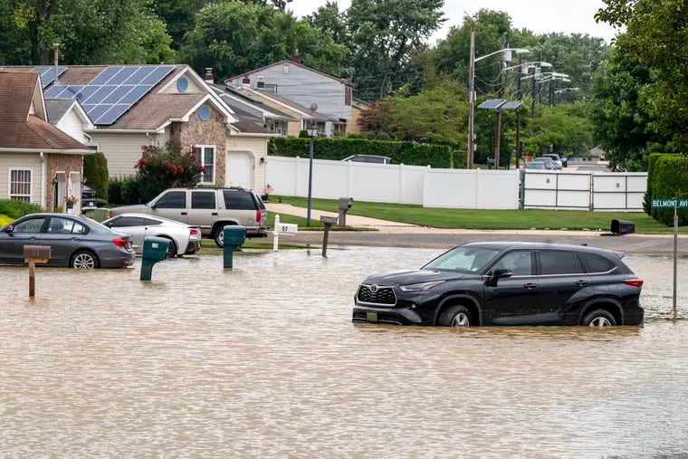 A car is abandoned on a street that remains flooded in the Silver Park West Estates in Edgewater Park, Burlington County. Some homes were also evacuated in the 55-and-older community due to flooding Tuesday night during heavy rains in Burlington County.