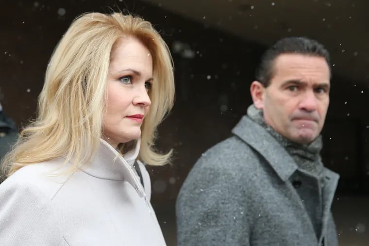 Marita Crawford, left, and her lawyer Fortunato Perri Jr., right, leave federal court in Philadelphia in 2019. She served prison time this year for embezzlement and will begin a new job with Philadelphia City Council in November.