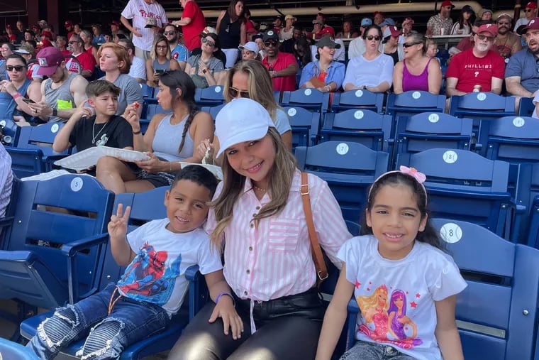 Ranger  Suárez's family watching him pitch on Wednesday at Citizens Bank Park: his wife, Joseany Cabello, daughter, Sofía Suárez, and son, Dominick Suárez.