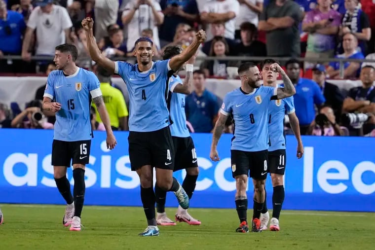 Uruguay's players celebrate their goal against the U.S. in the second half.