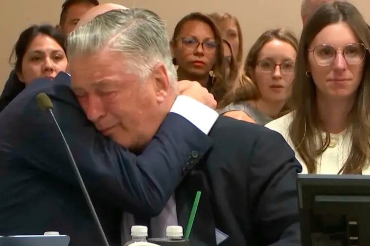 Actor Alec Baldwin reacts after the judge threw out the involuntary manslaughter case for the 2021 fatal shooting of cinematographer Halyna Hutchins during filming of the Western movie "Rust" on Friday at Santa Fe County District Court in Santa Fe, N.M.