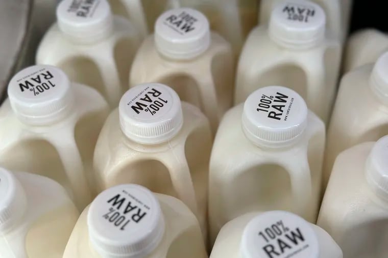 Bottles of raw milk are displayed for sale at a store in California.