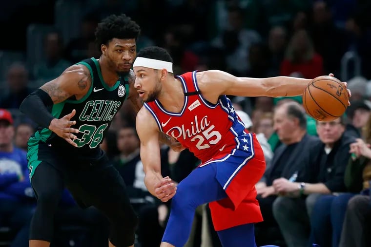 Ben Simmons (25) looks to move against Boston Celtics' Marcus Smart (36) during the first half.