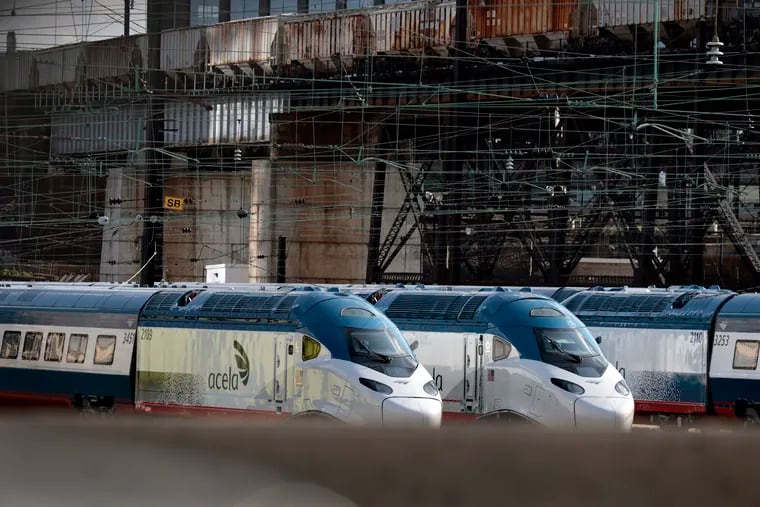 File photo of Amtrak Acela trains sit in the Amtrak yard adjacent to 30th Street Station in Philadelphia last August. A power outage had halted train service between Philadelphia and Connecticut, Thursday afternoon.