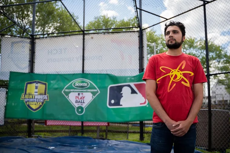 Director of Sports & Recreation for Lighthouse Fields, Julian Makarechi, poses for a portrait on one of the baseball fields on April 23.