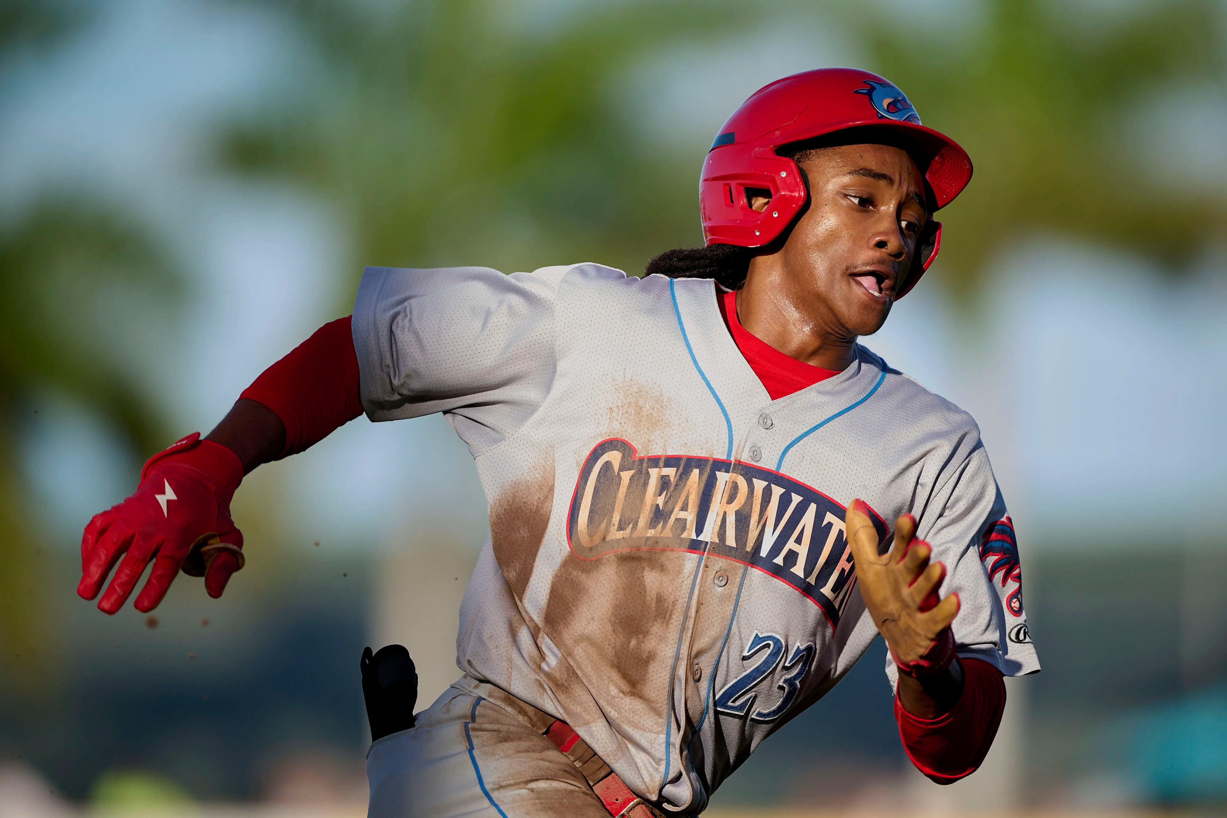 Clearwater Threshers Justin Crawford (13) loses his helmet as he slides  home safely during an MiLB Florida State League baseball game against the  Bradenton Marauders on April 8, 2023 at LECOM Park