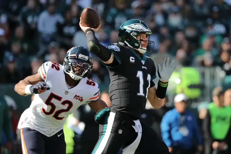 Eagles quarterback Carson Wentz under pressure from Chicago Bears outside linebacker Khalil Mack.