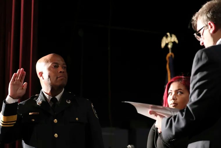 FILE - In this Sept. 8, 2017, file photo, newly appointed Minneapolis Police Chief Medaria Arradondo takes the oath of office as his daughter Nyasia looks on during a public swearing-in ceremony, in Minneapolis. George Floyd’s death and the protests it ignited nationwide over racial injustice and police brutality have raised questions about whether Arradondo — or any chief — can fix a department that's now facing a civil rights investigation.