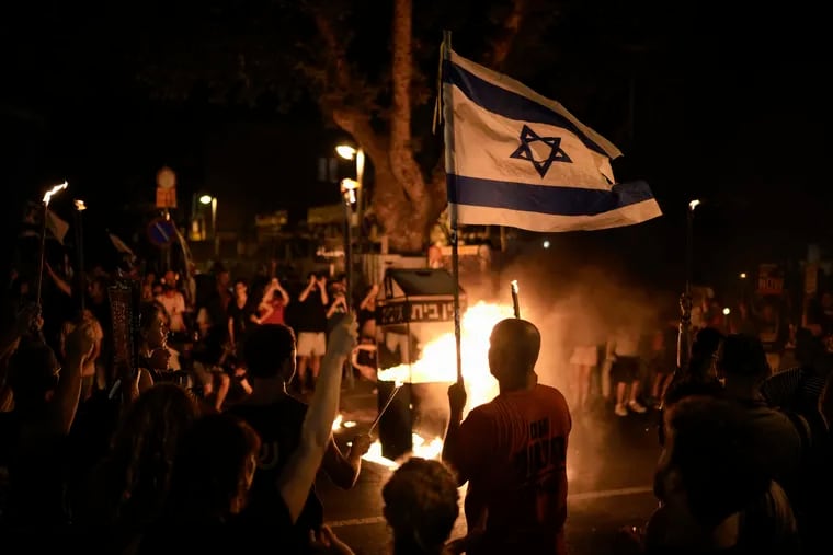 People protest against Israeli Prime Minister Benjamin Netanyahu's government and call for the release of hostages held in the Gaza Strip by the Hamas militant group, in Tel Aviv, Israel, on Saturday.
