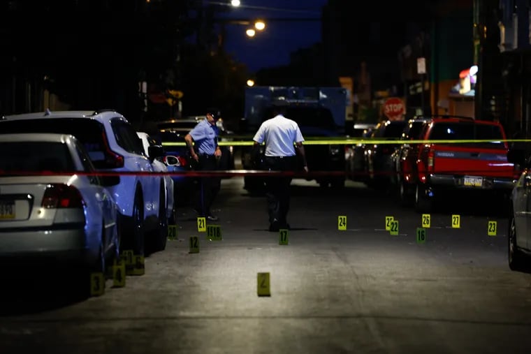 Police at the scene of a fatal shooting on the 3200 block of D Street in Kensington Wednesday evening.