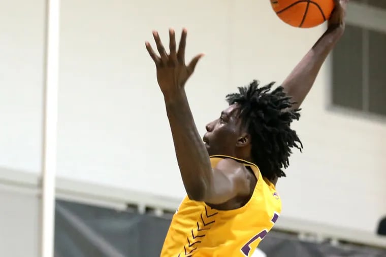 Aaron Bradshaw of Camden High goes up for a dunk against Archbishop Ryan during the Philly Live tournament for high school teams and the opportunities for college coaches to view large numbers of players.  It was played at Jefferson University on June 17, 2022 and the following days.