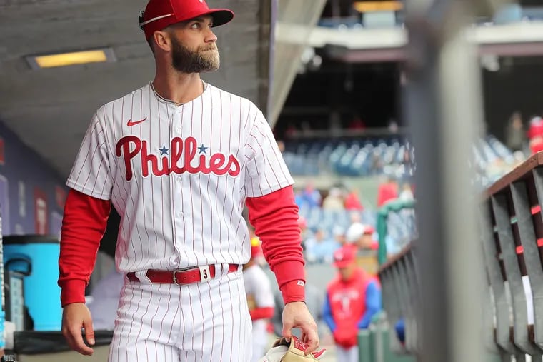 No plans for Phillies' Bryce Harper to resume throwing after examination  reveals little progress