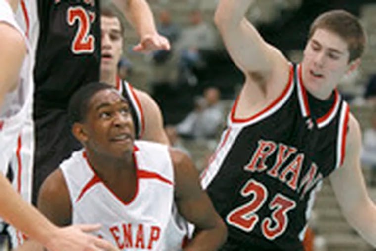 Lenape&#0039;s Isiah Dixon eyes the basket as he drives past Ryan defenders Tom Marshall (left) and Anthony Keiter.
