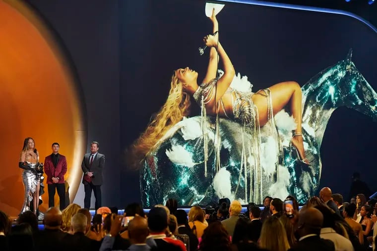 Beyonce, left, accepts the award for best dance/electronic music album for "Renaissance" at the 65th annual Grammy Awards on Sunday, Feb. 5, 2023.