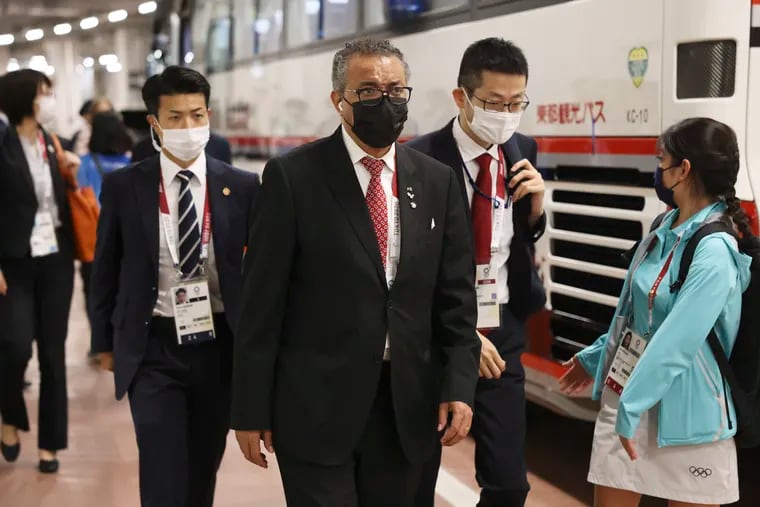 World Health Organization Director-General Tedros Adhanom Ghebreyesus, arriving at the opening ceremony for the Olympic Games on July 23, 2021, in Tokyo, Japan, has asked China to comply with further investigation into COVID-19's origins.
