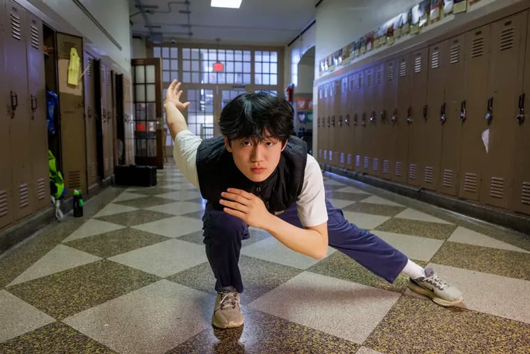 Lucas Koo, a 17-year-old Masterman student, is a speedskater who represented Brazil at the Winter Youth Olympics. He is shown here in a hallway of his school.