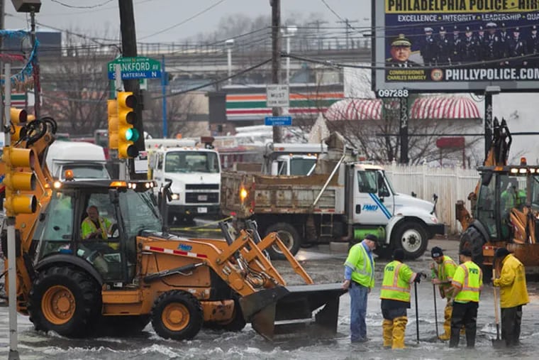 Philadelphia Water Department, Fire and Police were called to major water main break at intersection of Frankford Ave and Torresdale on Monday morning December 23, 2013. ( ALEJANDRO A. ALVAREZ / STAFF PHOTOGRAPHER )