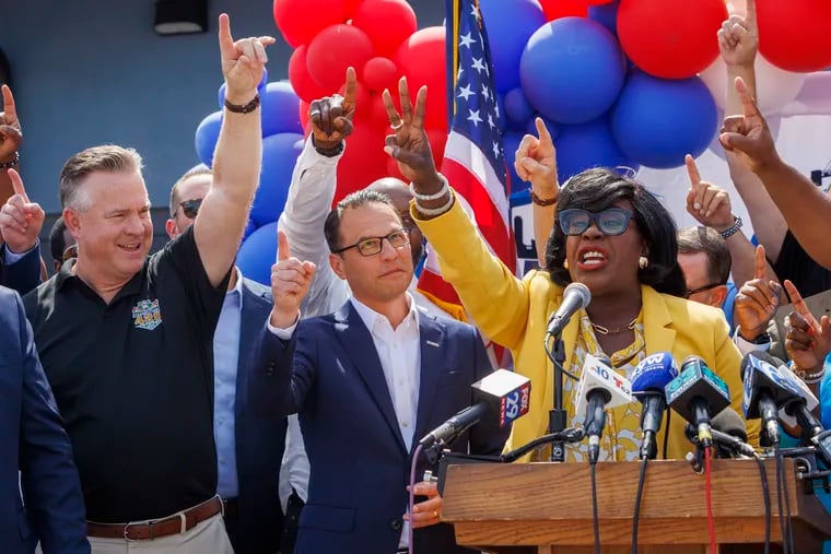 Mayor Cherelle Parker stands next to Gov. Josh Shapiro at a rally in support of Vice President Kamala Harris' presidential campaign at the Philadelphia Building Trades Union Hall in Northeast Philadelphia on Friday. Parker and others at the rally voiced support for Shapiro to become Harris' vice presidential nominee.