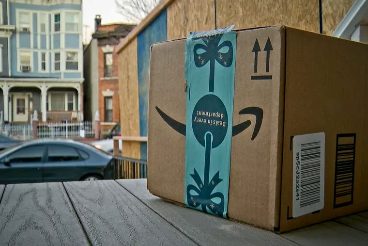 This image taken from video shows an Amazon package containing a GPS tracker on the porch of a Jersey City, N.J., residence after its delivery in 2018. The explosion in online shopping has led to porch pirates and stoop surfers swiping holiday packages from unsuspecting residents.