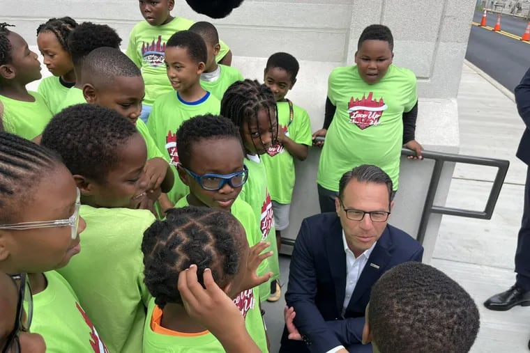 Pennsylvania Gov. Josh Shapiro meets with youth basketball players in North Philly on Tuesday.