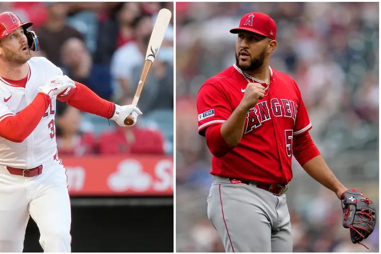 Los Angeles Angels Taylor Ward (left) and Los Angeles Angels relief pitcher Carlos Estevez (right)