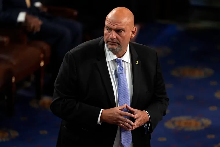 Sen. John Fetterman (D., Pa.) wears a pendant in support of freeing hostages being held by Hamas, before Israeli Prime Minister Benjamin Netanyahu speaks to a joint meeting of Congress at the Capitol on Wednesday.