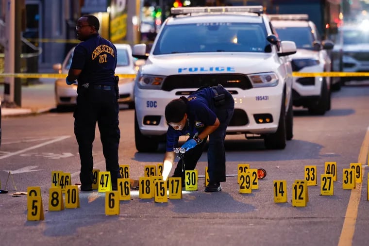 Police investigating the scene of a fatal shooting of a 25-year-old man on a mountain bike on Snyder Avenue at 15th Street in South Philadelphia on Wednesday,