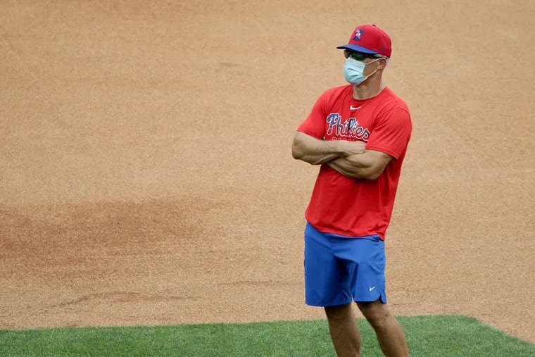 Manager Joe Girardi watches as the Phillies workout at Citizens Bank Park on Monday.