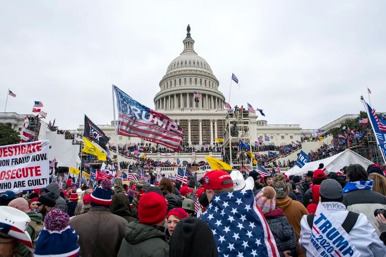 Rioters loyal to Donald Trump rally at the U.S. Capitol in Washington on Jan. 6, 2021. Over the weekend, the former president called for the "termination" of the Constitution to overturn the 2020 election.