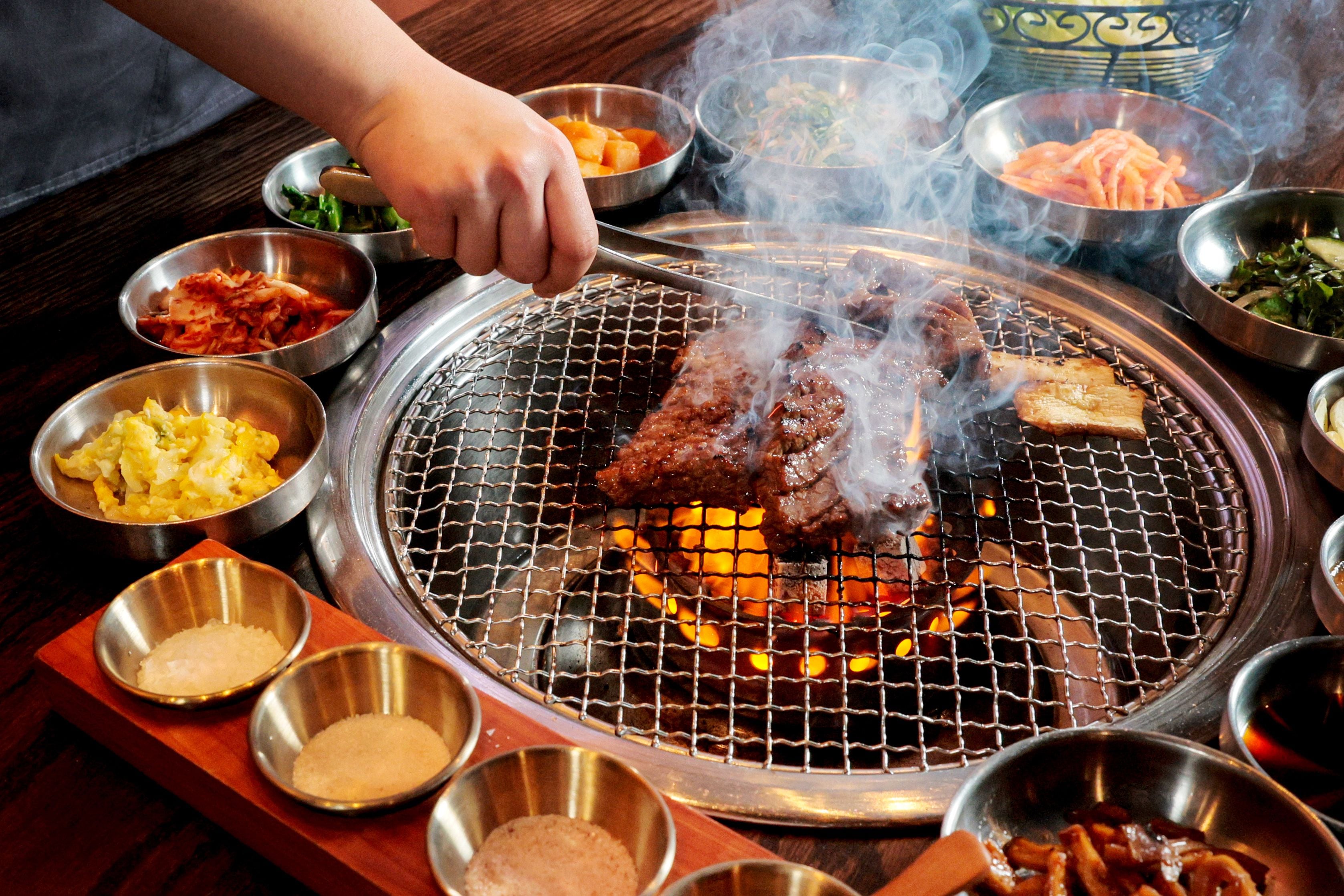 restaurant table with korean bbq grill