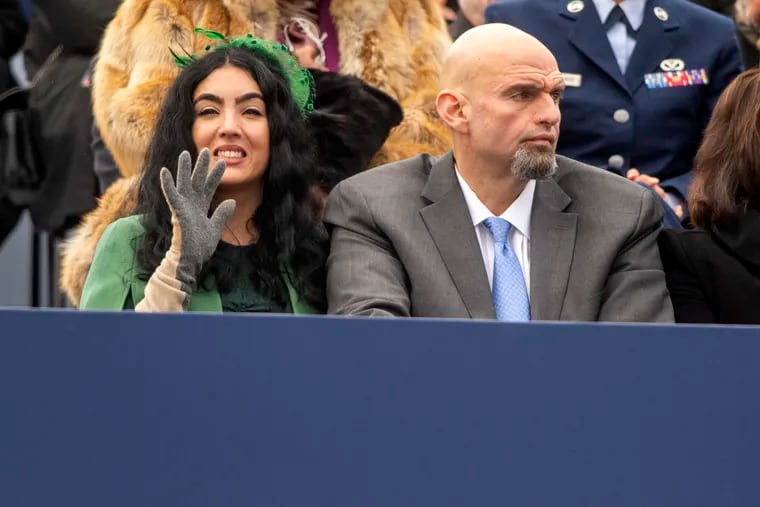 U.S. Sen. John Fetterman and his wife, Gisele, on stage during Gov. Josh Shapiro's inauguration ceremonies at the state Capitol in Harrisburg on Jan. 17, 2023.