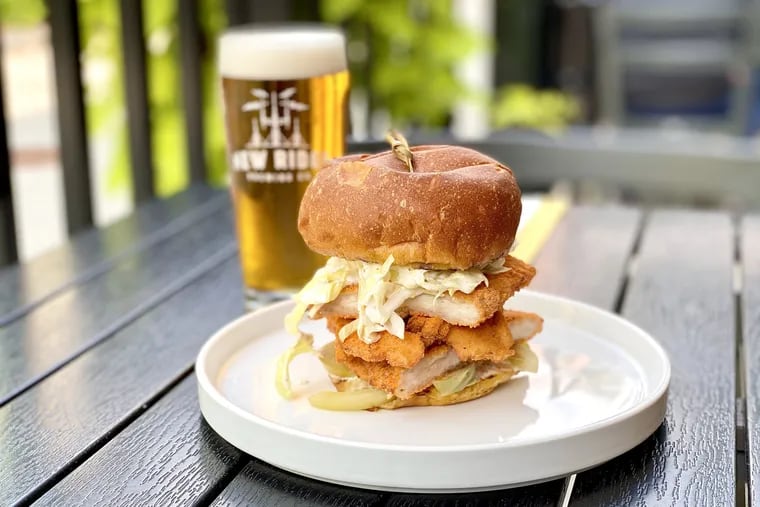 Chicken schnitzel sandwich with a beer at New Ridge Brewing Co. in Roxborough.