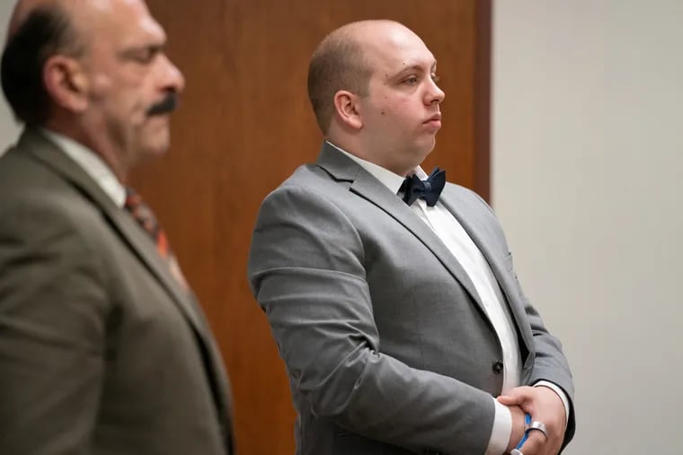 Former Gloucester Township Police Officer John Flinn (right) during his March 2020 trial in Camden County Superior Court. His attorney, Louis Barbone, stood next to him.