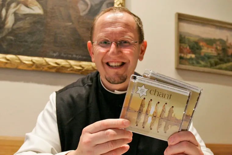 Father Karl Wallner holds copies of the &quot;Chant&quot; music CD. &quot;I get the sense this music is able to fill a vacuum within a lot of people,&quot; he said.