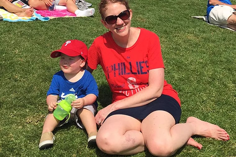 Kristen A. Graham and son Kieran take in a Phillies game in Clearwater, Fla. NORA GEORGE