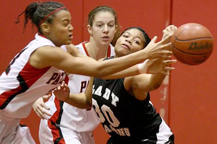 Germantown Academy's Jaryn Garner, left, goes after a loose ball with Freire Charter's Sierra Wilkinson. (Charles Fox/Staff Photographer)