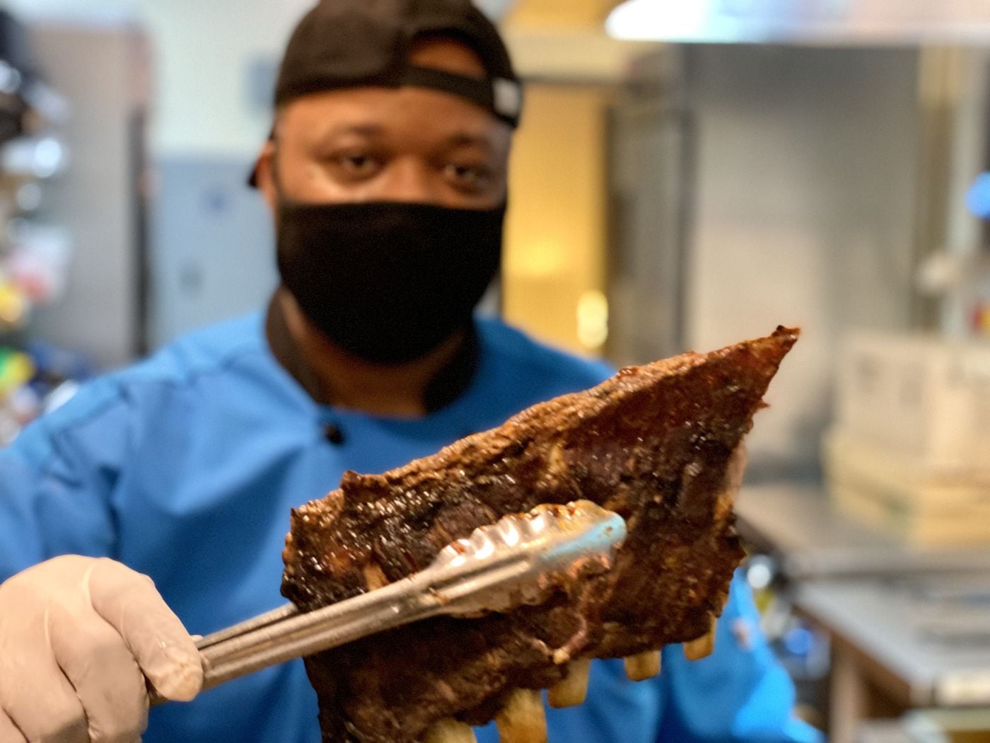 Sean Green with a half-rack of pork ribs at BBQ Unlimited.