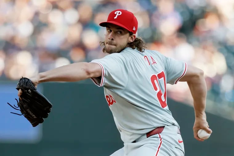 Aaron Nola recorded the first out of a triple play against the Tigers in the third inning.