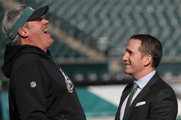 Eagles coach Doug Pederson (left) and general manager Howie Roseman (right) probably are safe regardless of what happens this season, Joe Banner says.