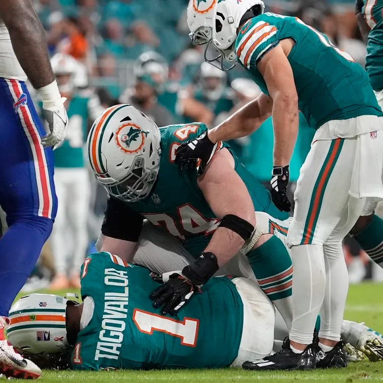 Miami Dolphins quarterback Tua Tagovailoa (1) lies on the field after suffering a concussion during the second half of an NFL football game against the Buffalo Bills, Thursday, Sept. 12, 2024, in Miami Gardens, Fla. (AP Photo/Lynne Sladky)