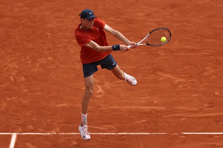 Jannik Sinner of Italy plays a backhand against Grigor Dimitrov of Bulgaria in the Men's Singles Quarter Final match during Day Ten of the 2024 French Open at Roland Garros on June 04, 2024 in Paris, France. (Photo by Clive Brunskill/Getty Images)