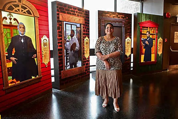 At the African American Museum in Philadelphia, its chief, Ramona Riscoe Benson, amid part of the permanent show, “Audacious Freedom: African Americans in Philadelphia, 1776-1876.” (David M Warren / Staff)